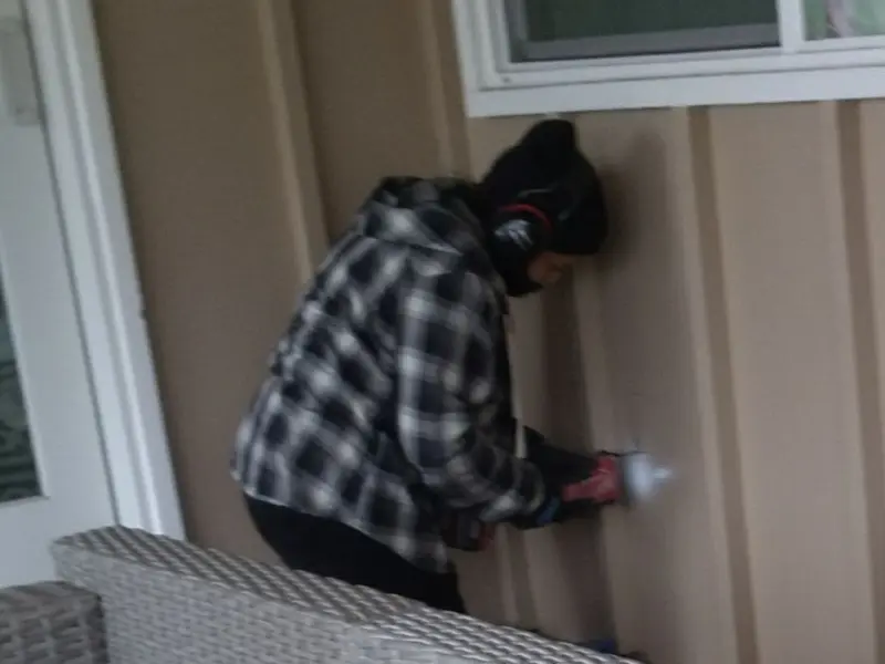 Professional electrician installing an exterior outlet in Conneaut