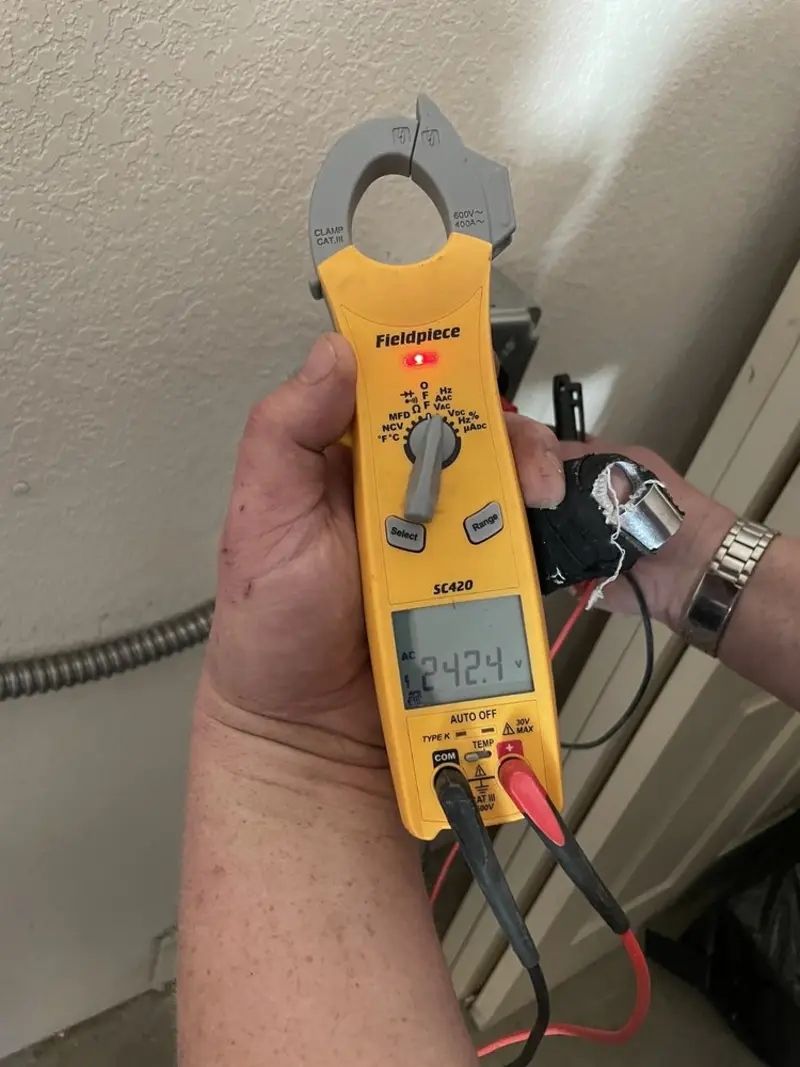 Voltage testing with clamp meter during Electrical Installation Services in Conneaut